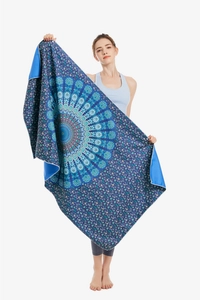 Detail of extra large microfiber beach towel with blue mandala print and white lockstitch edge