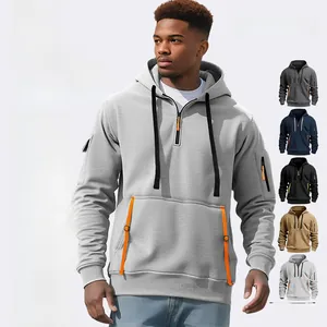 Close-up of fleece hoodie sleeve with orange zipper pocket and quality stitching details