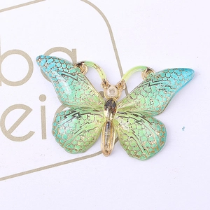 DIY jewelry butterfly pendant with green gradient enamel finish and gold metal frame