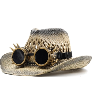 Steampunk straw jazz hat with vintage bronze goggles and spike detailing on white background
