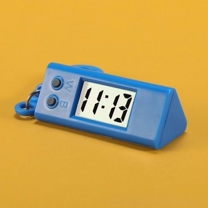 Close-up of blue triangular digital pocket watch with functional buttons and metal keyring