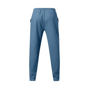 Rear view of misty blue sports sweatpants with elastic drawstring waist and knit texture