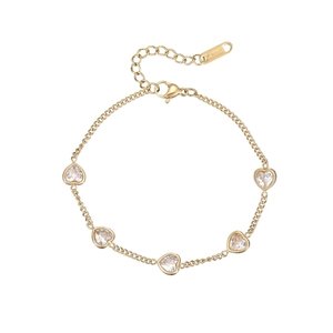 Golden stainless steel heart bracelet featuring five clear zircon stones on a white background