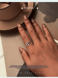 Close-up of S925 sterling silver dragon scale wrap ring worn on a finger