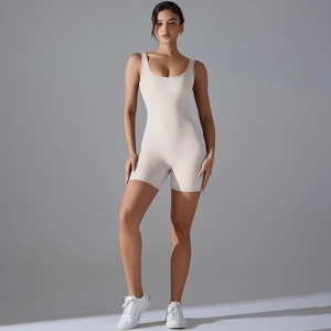 Close-up of beige ribbed athletic jumpsuit with low-back design and thick straps