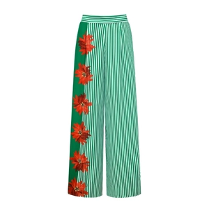 Detailed pattern of green white stripes and red floral print on high waist wide leg pants