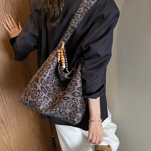 Retro leopard print tote bag with wooden bead charm and spacious interior on shoulder