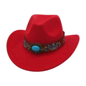 Detail of red felt cowboy hat with blue floral embroidery and turquoise buckle on band