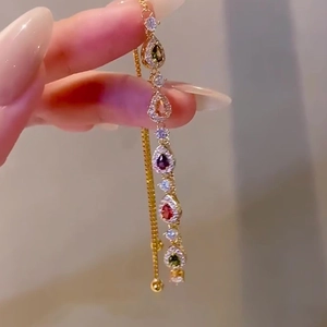 Adjustable gold bracelet featuring colorful teardrop-shaped zircon stones in a main product view