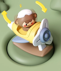 Rotating cartoon monkey airplane toy with musical notes and 360-degree motion arrows