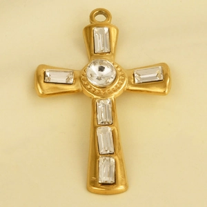 Macro detail of gold stainless steel cross pendant with sparkling inset crystal stones