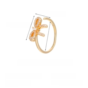 Detailed view of a gold bow ring with small zircons, featuring 1.8cm diameter and 2.6g weight