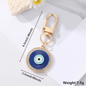 Detailed view showing dimensions and weight of the blue enamel evil eye keychain accessory