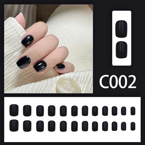 Short minimalist solid black glossy press-on nails with square oval shape in 24 piece set