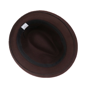Detail shot of vintage fedora inner lining with 100% polyester material label and size 57