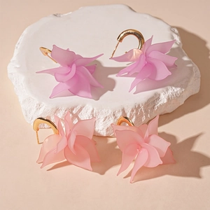 Floral acrylic C-shaped earrings in purple and pink gradient with gold metal hooks