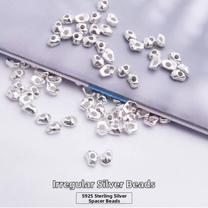 Macro shot of irregular S925 sterling silver loose beads for DIY jewelry making