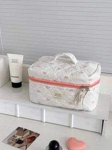 Trousse à maquillage matelassée à motifs nœuds roses avec poignée et double fermeture