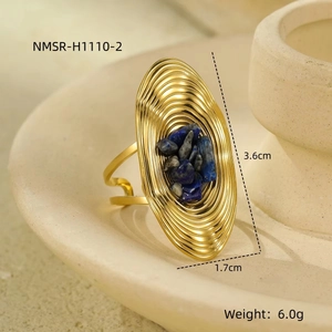 Detailed view of a gold rippled oval ring with inlaid blue stones and precise measurements