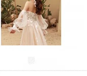 Detail view of the invisible back zipper on a lace off-shoulder bridal gown