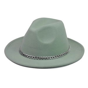 Detail of mint green wool fedora hat featuring a stylish silver metal chain band