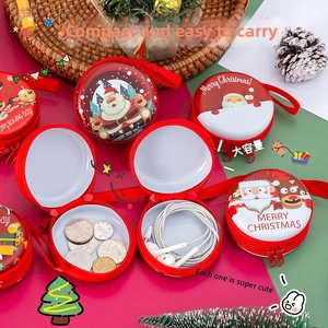Macro shot of circular Christmas coin purses with reindeer and Santa designs