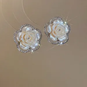 Elegant floral pearl drop earrings with sparkling rhinestones in a luxury jewelry set