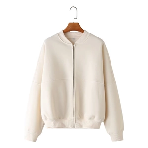 Detail of cream white zip-up bomber jacket collar showing XS size label and soft fabric