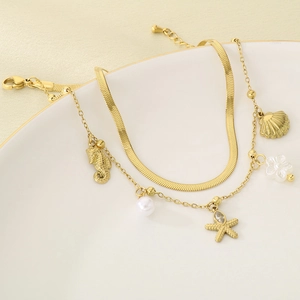 Zweilagiges goldenes Edelstahl-Fußkettchen mit Seestern-, Muschel- und Seepferdchen-Anhängern