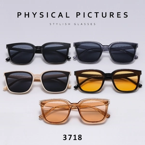Multi-color collection of large square sunglasses in black, grey, cream, and amber finishes