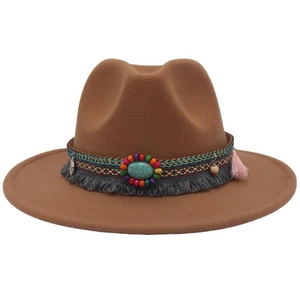 Detail of bohemian felt fedora with colorful beads, turquoise stones and tassels