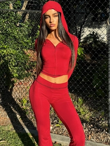 Women's red two-piece tracksuit set with hooded zip jacket and flared leggings
