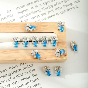 Silver marine ocean series earrings with blue teardrop zircon and white pearl on wood