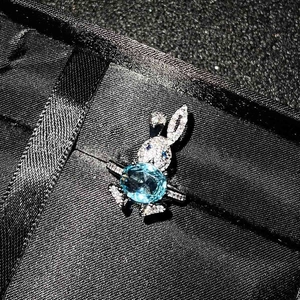 Sparkling rabbit necklace with sky blue topaz stone and pavé cubic zirconia