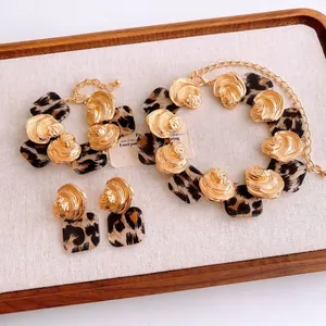 Fashion jewelry set with leopard print resin squares and golden shell textured elements