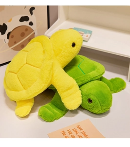 Close-up of soft plush sea turtle toys in green and yellow with premium plush texture