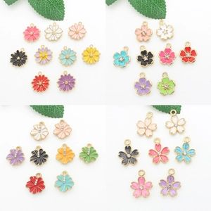 Detailed view of colorful alloy flower charms with small rhinestones for DIY jewelry crafts