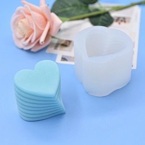 Stackable heart shaped silicone candle mold with layered DIY craft finished product