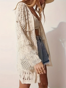 Women's cream boho hollow crochet cardigan and matching top with denim shorts