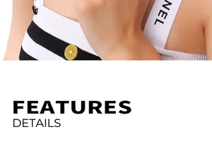 Detail of black and white striped top featuring lettered wide shoulder straps
