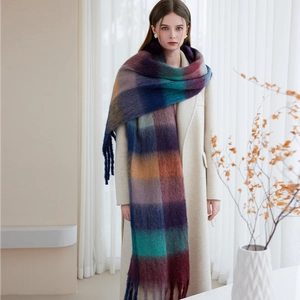 Thick winter scarf with colorful plaid pattern and tassels, warm brushed fleece texture