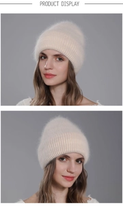 Detail showing plush rabbit fur texture and knit pattern on a warm winter beanie