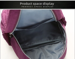 Detail view of the purple nylon backpack main compartment with interior zipper pocket