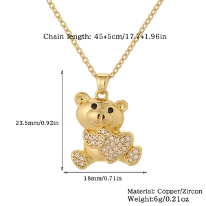 Detailed view of bear pendant necklace with heart zircon and size measurements