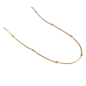 Elegant 18K gold plated snake chain necklace with gold beads on a clean white background