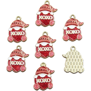 Detail of red and gold Santa pendants with XOXO lettering and golden grid back texture