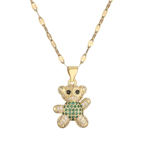 Cartoon gold necklace with a micro-paved bear pendant featuring clear and green zircons