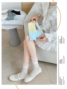 Detail showing elastic double-ribbed cuffs and soft knit texture of ballet style socks