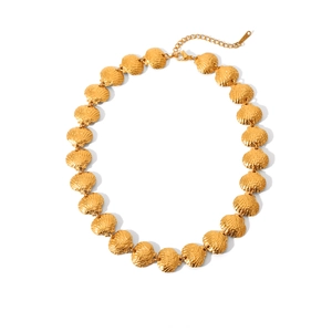 Detailed view of the 18K gold-plated stainless steel shell necklace with adjustable chain