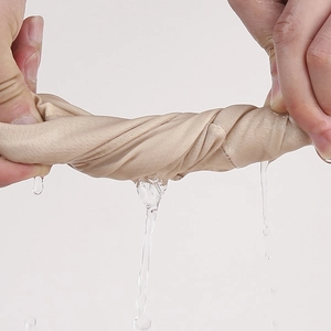Close-up showing the quick-dry and breathable knit fabric being wrung out by hand